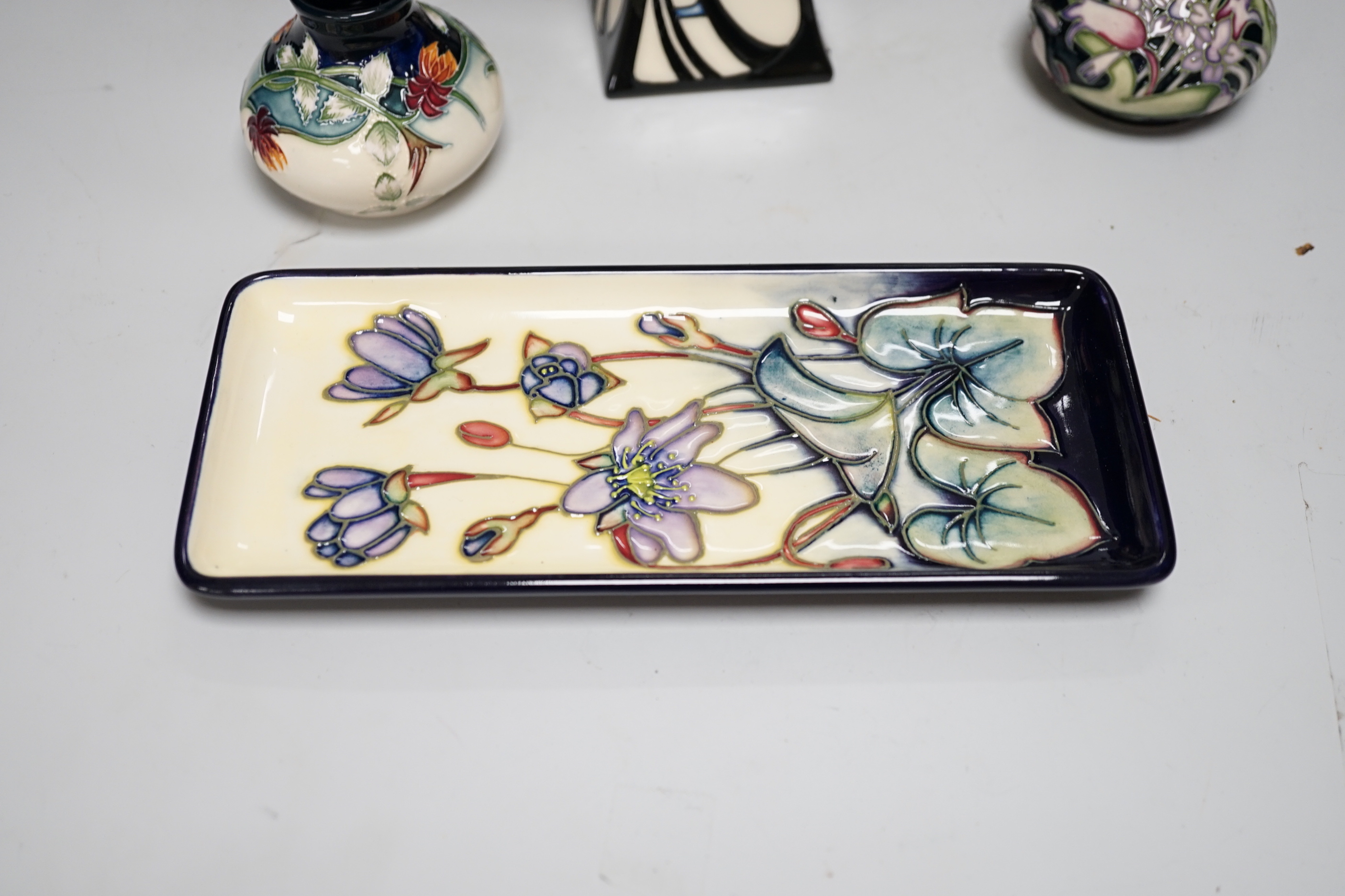 A group of Moorcroft vases, a lamp base and a pin dish, tallest 37cm